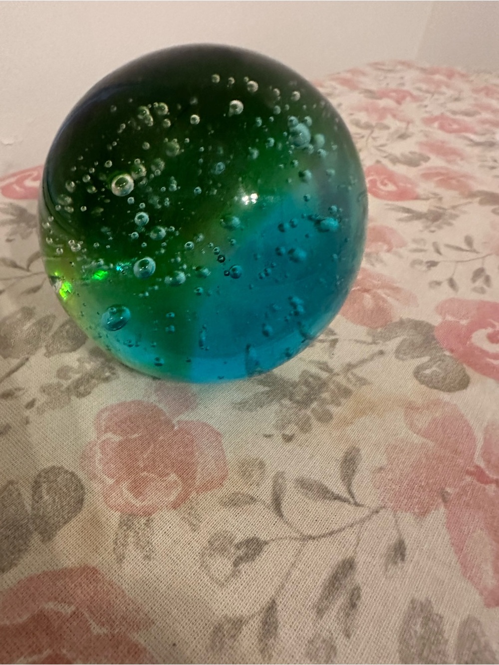a blue and green controlled bubbles art glass paperweight